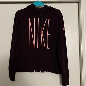 Medium Nike hoodie. Burgundy color with pink lettering.